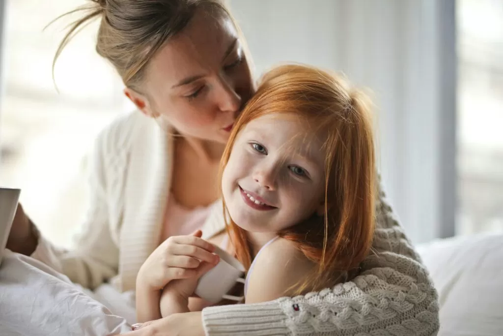 Mother and daughter showing love to each other