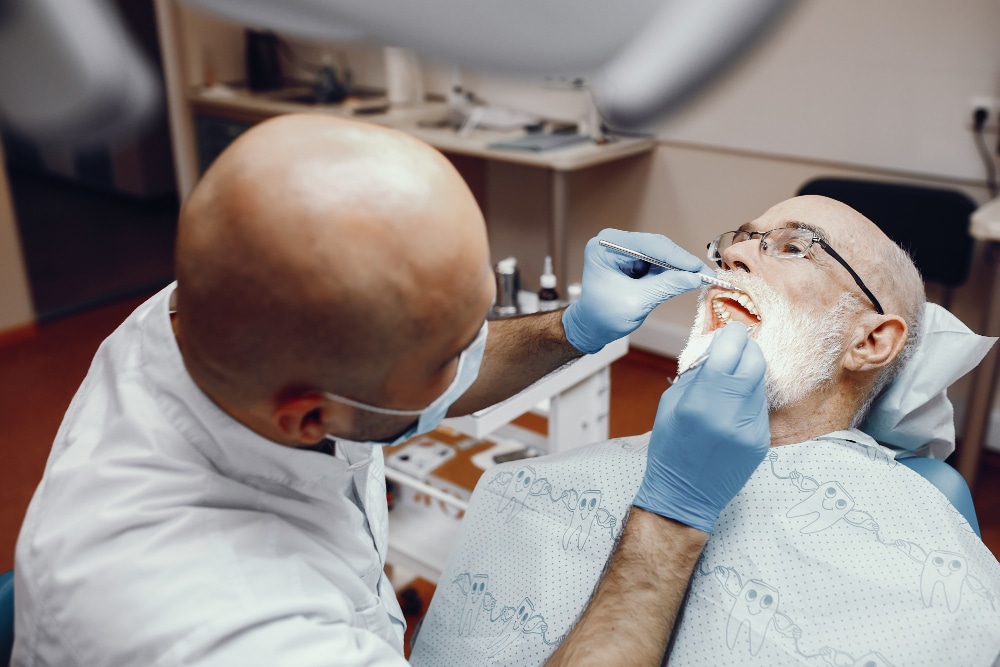  Patient getting a dental crown fitted during a dental visit.