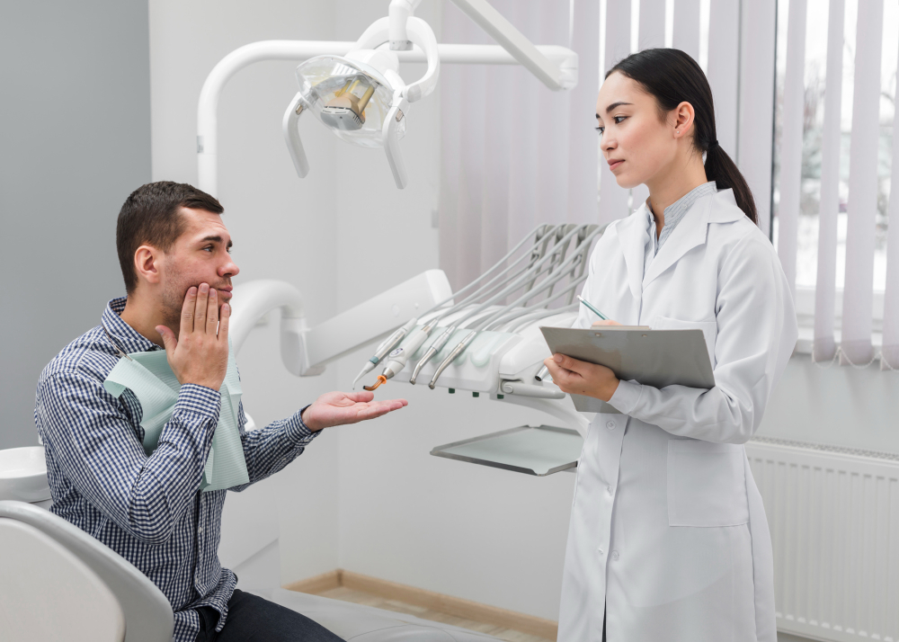 Dentist discussing wisdom tooth extraction options with a patient