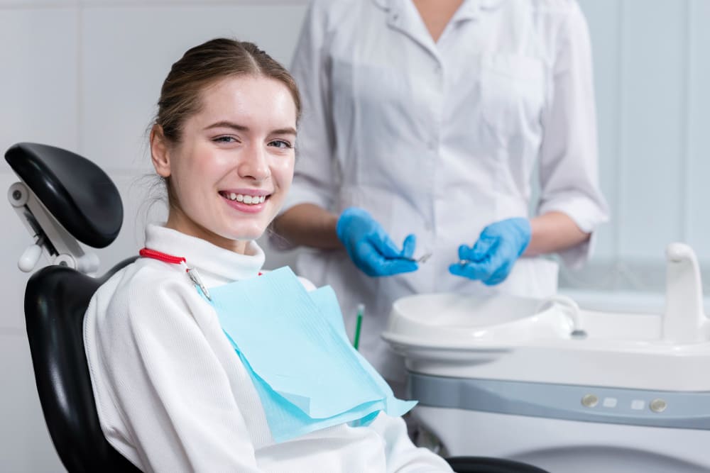 Smiling patient after successful gummy smile laser treatment