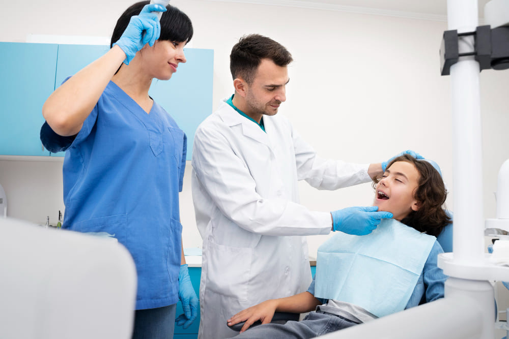 Dentist examining a patient's teeth during a routine dental checkup