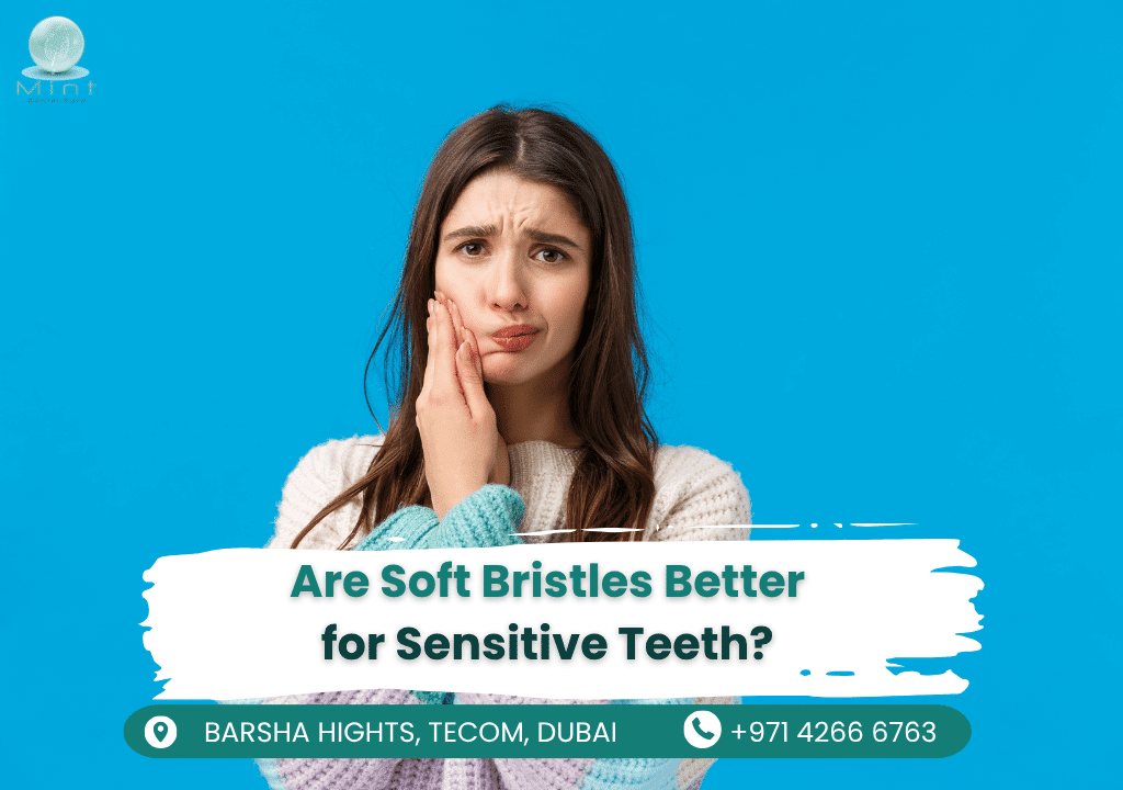 Close-up of soft-bristled toothbrush gently cleaning sensitive teeth and gums to prevent irritation while removing plaque.