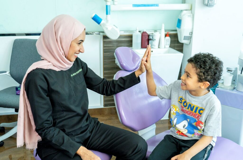 Parent reading a book about visiting the dentist with their child to reduce dental anxiety